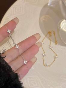 Vòng tay vàng 18k mạ đồng đính đá Cubic Zirconia chất lượng cao của Châu Âu và Mỹ, kiểu dáng hình cỏ bốn lá đính kim cương nhân tạo, phụ kiện trang sức sang trọng dành cho nữ giới, món quà lý tưởng. - Vàng - Xem 1
