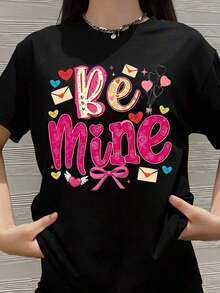 Camiseta "Sé Mi Amante" para el Día de San Valentín, Diseño Romántico de Corazón para Mujeres y Niñas, Bonito Regalo para el Día de San Valentín, Top de Moda con Estampado de Sobre y Globo - Negro - Ver 1
