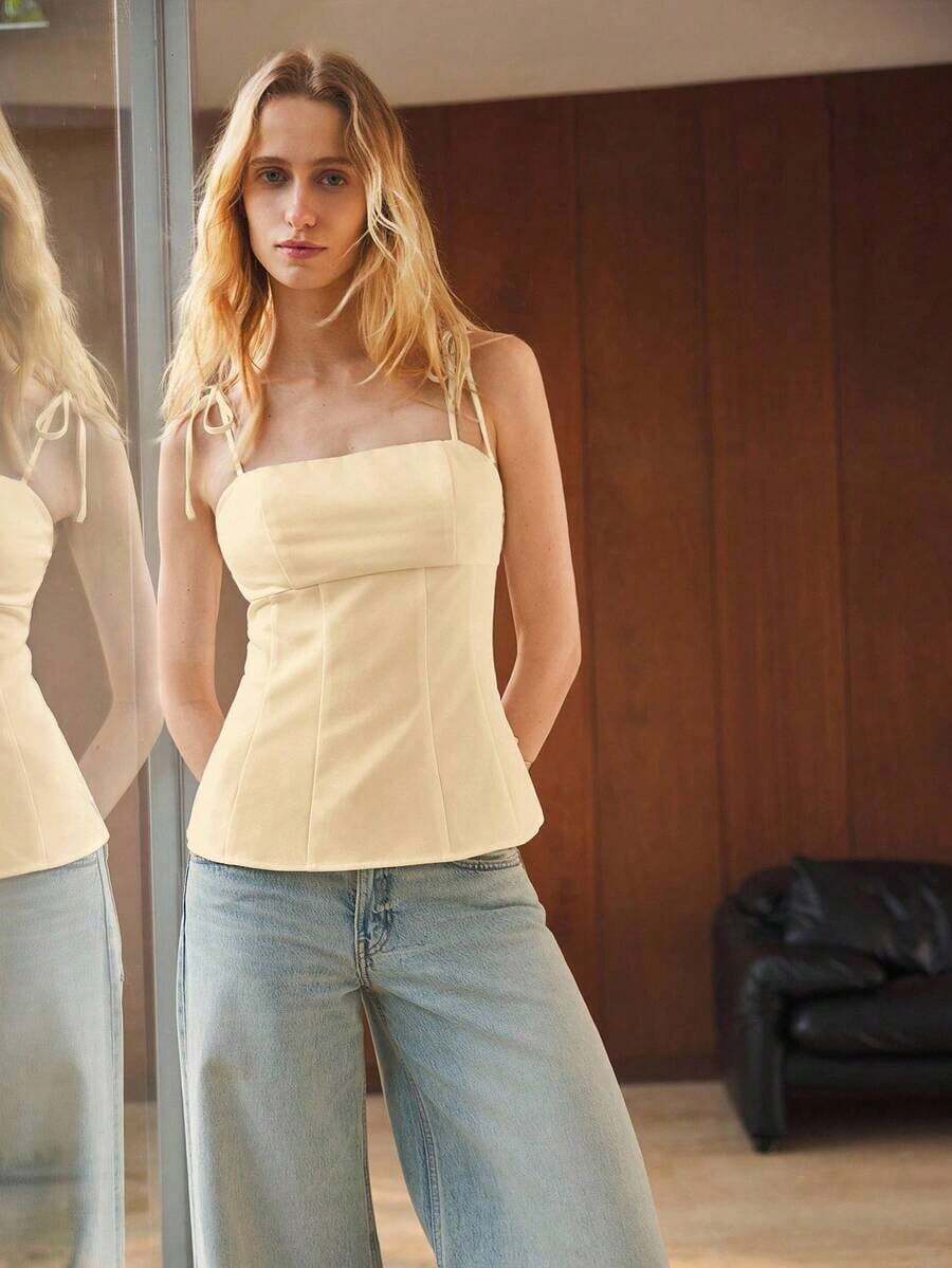 Camiseta sin mangas de verano para mujer, con un diseño de unicolor minimalista y cintura ceñida para una silueta favorecedora.Elegante pero sencilla, adecuada para ocasiones formales como conciertos y actuaciones, así como para un uso casual - Albaricoque - Ver 1