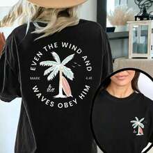 Camiseta Casual de Corte Holgado para Mujer con Estampado Cristiano "Incluso el Viento y las Olas Le Obedecen", Transpirable y Cómoda, de Algodón Puro, Manga Corta, Cuello Redondo con Estampado de Palmeras y Ondas, Camiseta Blanca de Estilo Urbano para Uso Diario de Verano. - Negro - Ver 1