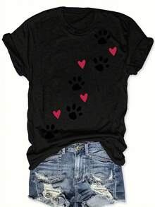 1 pieza de camiseta casual de mujer con cuello redondo, con estampados de patas y corazones, hecha de tejido de punto de poliéster, de longitud regular, top de verano. - Negro - Ver 1