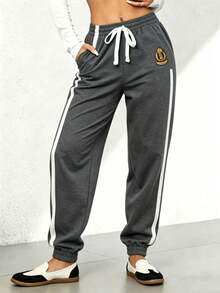 Pantalones largos informales sólidos con efecto de mezclilla y encaje lateral para mujeres - Gris Oscuro - Ver 1