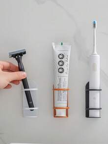 Portaspazzolino elettrico da parete senza foratura (1 pezzo) - Scaffale di stoccaggio per il bagno. Questo innovativo supporto può essere posizionato sul bancone o montato a parete, e presenta fori di drenaggio per prevenire che l'umidità e i residui influenzino la porta di ricarica. Perfetto per bagni, dormitori e luoghi simili, è una soluzione di stoccaggio domestica creativa e pratica. - Multicolore - Visualizzare 1