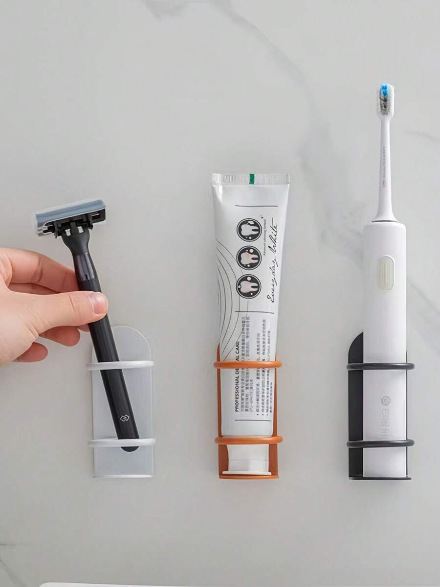 Portaspazzolino elettrico da parete senza foratura (1 pezzo) - Scaffale di stoccaggio per il bagno. Questo innovativo supporto può essere posizionato sul bancone o montato a parete, e presenta fori di drenaggio per prevenire che l'umidità e i residui influenzino la porta di ricarica. Perfetto per bagni, dormitori e luoghi simili, è una soluzione di stoccaggio domestica creativa e pratica. - Multicolore - Visualizzare 1