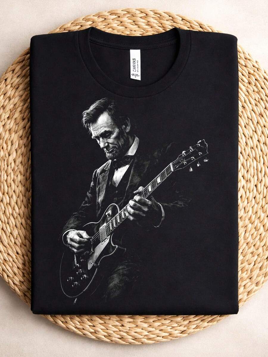 Camiseta Abraham Lincoln tocando la guitarra, Camiseta Abraham Lincoln R1OCk, Camiseta de guitarra R, Camiseta negra, Camiseta para amantes de la música. Camiseta unisex de algodón puro de 220 g, peso ideal para todas las estaciones, adecuada tanto para hombres como para mujeres. Tejido duradero de alta calidad, suave al tacto y de larga duración. Parte superior transpirable. Adecuada para la primavera y el verano de las mujeres, vacaciones, Día de la Madre, Día de la Independencia. - Negro - Ver 1