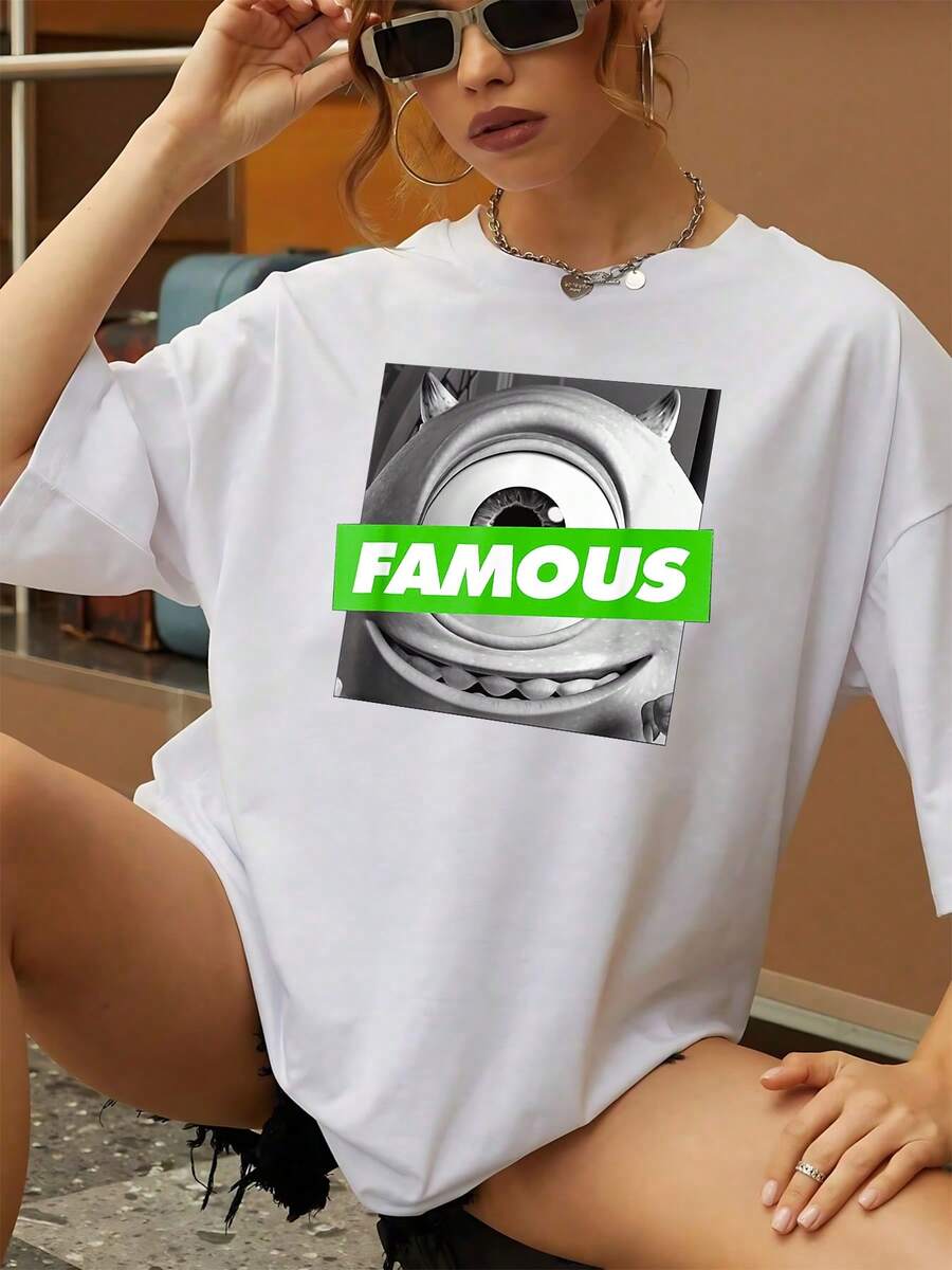 La imagen muestra un personaje caricaturesco con un gran ojo único y una sonrisa amistosa que representa humor confianza y atención al detalle evocando una actitud divertida y segura camiseta de mujer casual cómoda ideal para combinar con jeans - Blanco - Ver 1