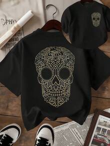 Cráneo brillante formado por patrones dorados que simbolizan la energía eterna y la conexión con la vida decorado con detalles que evocan elegancia y renacimiento camiseta de mujer de doble cara con estampado artístico - Negro - Ver 1