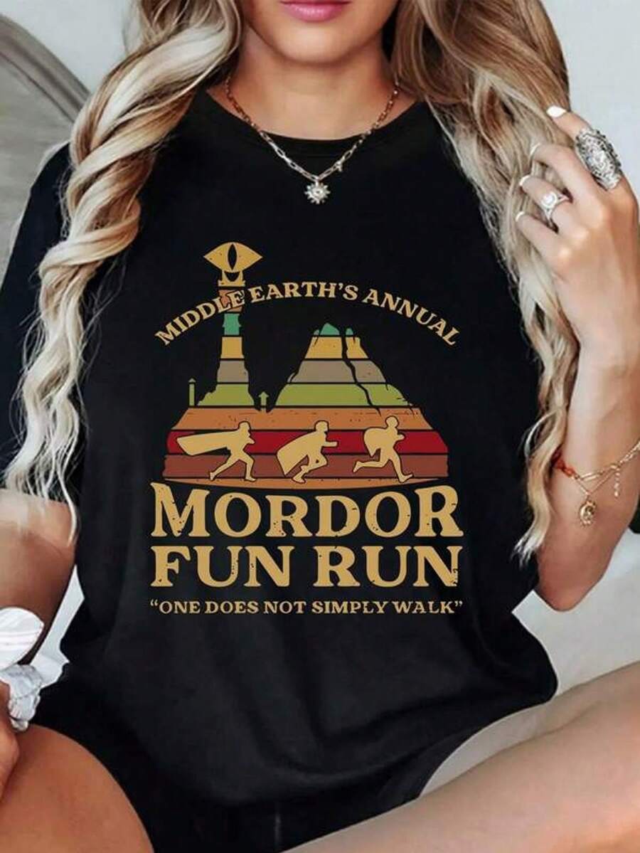 Graphic Depicting A Fun Fantasy Race Through Mountains With Figures Running Towards A Tower Watched Over By An Eye, A Symbol Of Adventure, Humor, And Overcoming Challenges. Women's T-Shirt, 100% Cotton - 黑色 - 查看 1