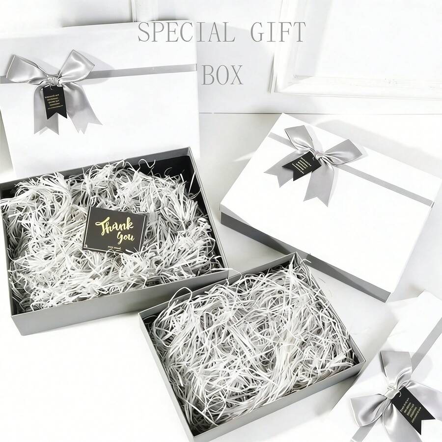 1 Hộp quà hình nơ cỡ lớn có nắp (bao gồm 30g sợi raffia trắng). Rộng rãi đủ để đựng khăn quàng cổ, quần áo, mũ và mỹ phẩm. Một hộp quà đơn giản và trang nhã. - Xem 1