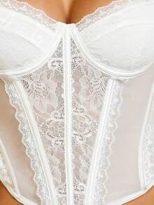 Yuwenier Elegante e sexy top in pizzo bianco traslucido con patchwork, bustier aderente stile scheletro con orlo asimmetrico e spalline regolabili, shapewear adatto per San Valentino, festival musicali, matrimoni in primavera/estate - Bianco - Visualizzare 6
