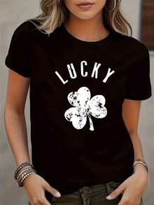 Camiseta de manga corta con estampado de trébol de la suerte para mujer - Blusa casual con cuello redondo negro y diseño de cuatro tréboles, top opaco lavable a máquina para atuendos casuales, esencial para vestimenta neutra durante todo el año. - Negro - Ver 1