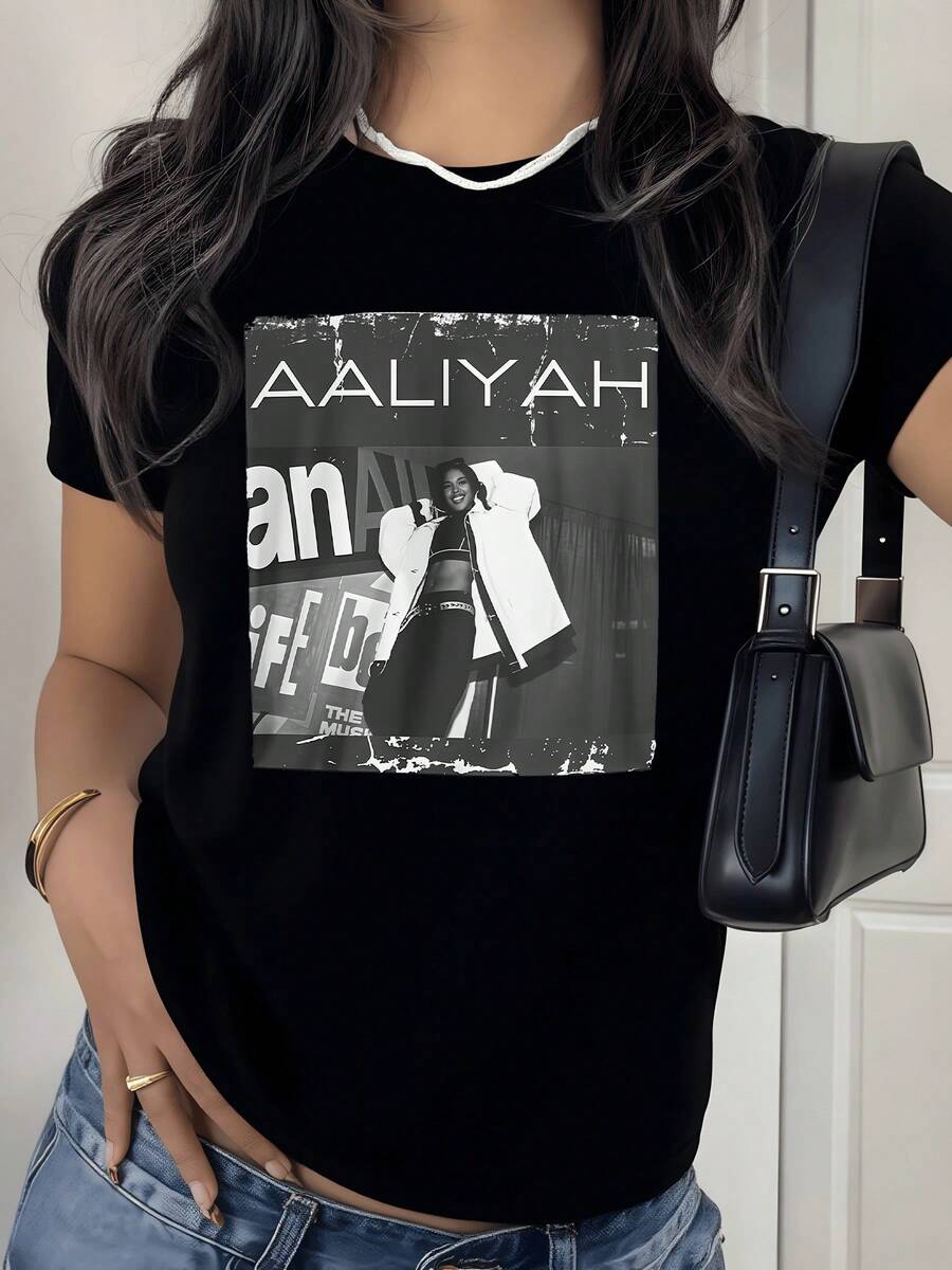 Figura artística en blanco y negro que muestra una silueta femenina con actitud confiada transmitiendo fuerza y elegancia urbana camiseta de mujer moderna casual cómoda para uso diario - Negro - Ver 1