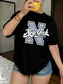 Camiseta negra informal extragrande para mujer con estampado gráfico de la ciudad de Nueva York, manga corta y cuello redondo, estilo streetwear Y2K. - Negro - Ver 1