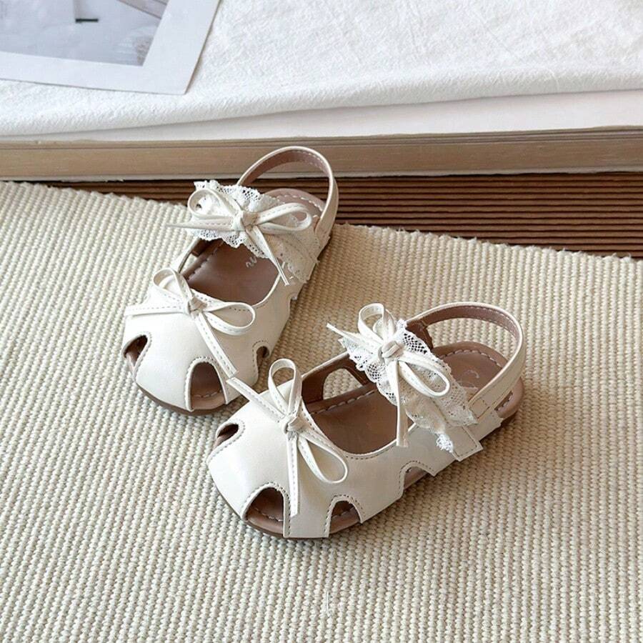 1 đôi sandal bít mũi ren nơ cho bé gái, giày công chúa ngọt ngào cho trẻ em, sandal đế mềm chống trượt có khóa dán cho bé, sandal mùa hè - Màu be - Xem 1