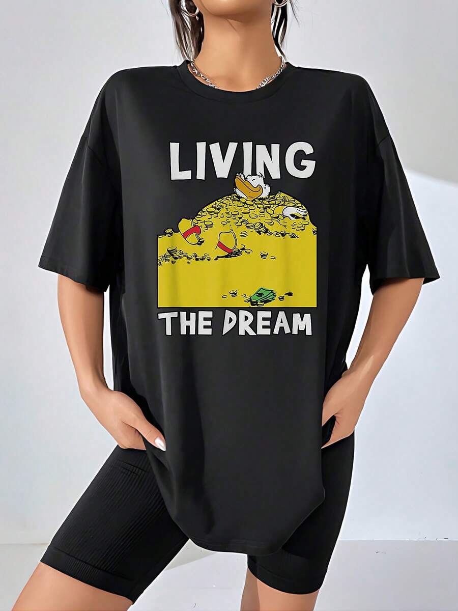 Happy Duck Enjoying A Huge Mountain Of Golden Coins Symbolizing Fulfilled Dreams, Success, And Joy With A Fun Message Of Motivation And Prosperity. Casual And Comfortable Women's T-Shirt - 黑色 - 查看 1