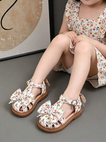 Giày sandal in hoa cho bé gái - Thiết kế nơ xinh xắn, mũi kín, đế mềm chống trơn trượt, giày công chúa mùa hè cho trẻ em.