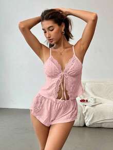 El traje de encaje negro de la señora es tanto romántico como sexy.Es adecuado para fiestas y también se puede usar para combinaciones de ropa de temporada.Combina materiales de punto y encaje y tiene un lazo en la cintura.Este es un conjunto de - Rosa - Ver 4