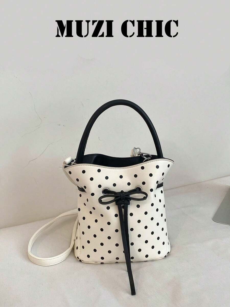 This Black And White Polka Dot Drawstring Bucket Bag Features A Bow Decoration That Adds A Touch Of Girlish Charm. Made Of Durable And Easy-To-Care-For PU Material, It Can Be Carried By Hand Or Worn Crossbody. Simple And Versatile, It's Perfect For Female College Students Commuting To Class, Going Out On Campus, Or Shopping With Friends. - White - View 1