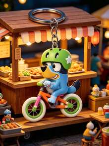 Bluey A 騎單車造型鑰匙圈，以動畫角色為原型，將可愛的藍色狗狗轉化為充滿活力的騎士，戴著綠色安全帽並飾有白色星星裝飾，可輕鬆掛在通勤包、運動包或鑰匙圈上 - 多款 - 查看 6
