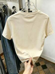 Camiseta de manga corta para mujer con cuello redondo, corte holgado, con estampado de flor de margarita y leyenda cursiva "Smile", apta para uso diario, salidas casuales, fines de semana, vacaciones, actividades al aire libre y reuniones informales, fabricada en poliéster, de estilo casual fresco juvenil, ideal para usar en primavera y verano. Envío nacional dentro del país. - Albaricoque - Ver 2
