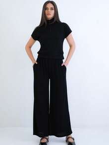 Women's Two-Piece Set Featuring A Short Sleeve Mock Neck Top With Half Zip Closure And Matching High-Waist Wide Leg Pants. Designed For A Relaxed, Comfortable, And Modern Coordinated Look. - Black - View 1