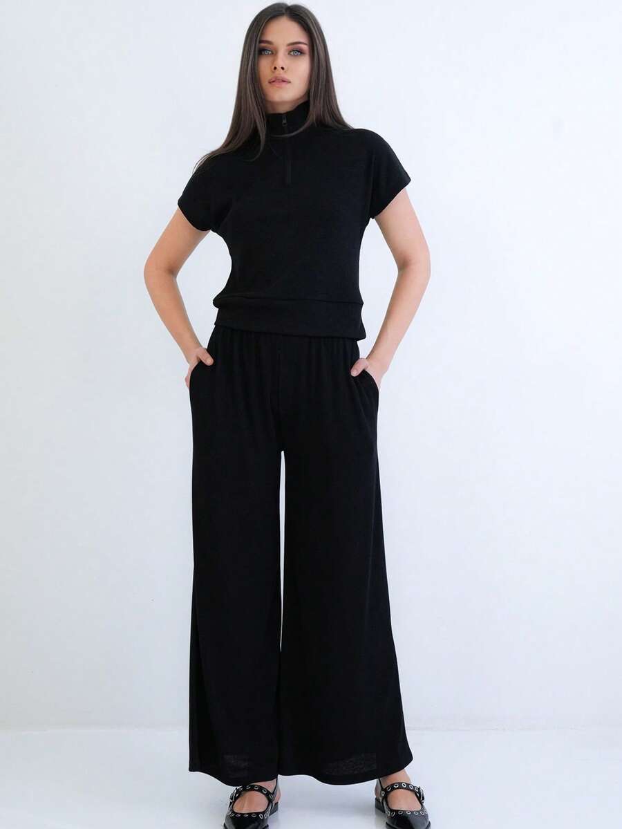 Women's Two-Piece Set Featuring A Short Sleeve Mock Neck Top With Half Zip Closure And Matching High-Waist Wide Leg Pants. Designed For A Relaxed, Comfortable, And Modern Coordinated Look. - Black - View 1