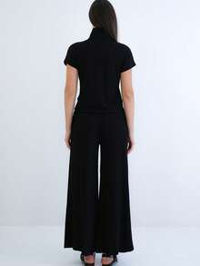 Women's Two-Piece Set Featuring A Short Sleeve Mock Neck Top With Half Zip Closure And Matching High-Waist Wide Leg Pants. Designed For A Relaxed, Comfortable, And Modern Coordinated Look. - Black - View 6