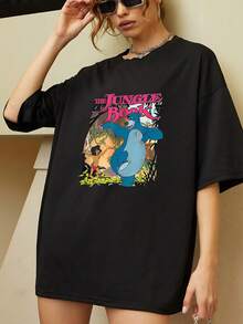 Vibrant Illustration Showing An Adventurous Boy And A Blue Bear Dancing In The Jungle, Symbolizing Freedom, Friendship, And Joy. Comfortable Casual Women's T-Shirt, Perfect For Everyday Wear. - 黑色 - 查看 6