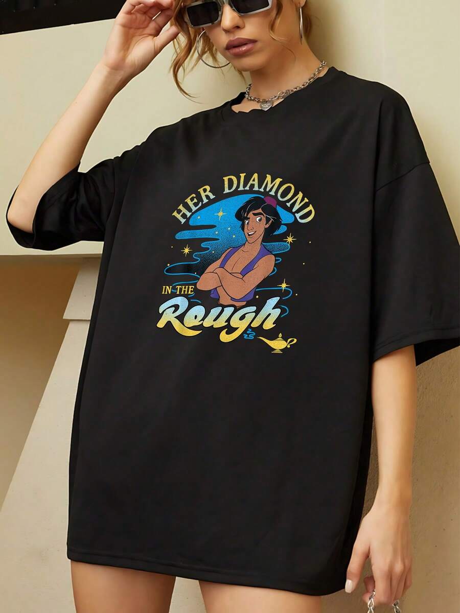 The Print Shows A Strong Woman Surrounded By Golden Stars And A Magic Lamp Symbolizing Hope And Inner Strength. This Comfortable And Soft Women's Short-Sleeved T-Shirt Is Perfect For Everyday Wear. - Black - View 1