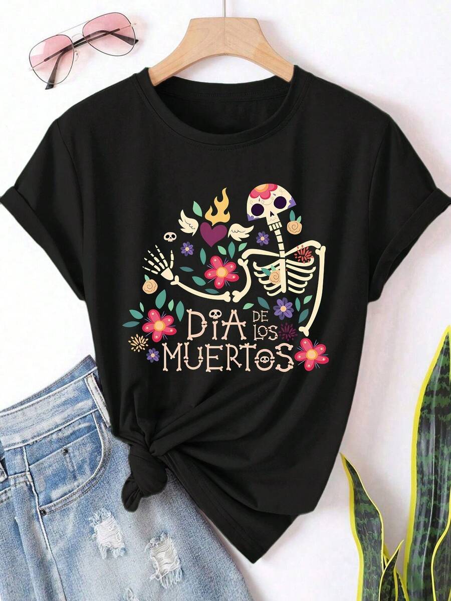 Camiseta de mujer para el Día de Muertos mexicano - Estampado de calaveras de azúcar y calentos, cuello redondo, mangas cortas, holgada, casual y cómoda, lavable a máquina, adecuada para el Día de Muertos en primavera, verano y otoño, fiestas temáticas y atuendos casuales, con diseño floral y texto en español, estampados festivos de calaveras y flores, corte holgado de moda para mujer. - Negro - Ver 1