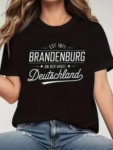 Camiseta de mujer con temática alemana y diseño de la Puerta de Brandeburgo - Estampado en blanco y negro de Alemania con la bandera alemana y el contorno del estado, corte holgado, manga corta, cuello redondo, letras "Brandybourg" y "1990" para el orgullo alemán, diseño "Baviera-Distancia". - Negro - Ver 7