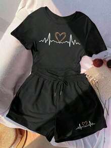 Almacén local, una camiseta de manga corta para mujer con estilo retro americano, de corte holgado y diseño estampado (los pantalones son solo para sugerencias de estilo). Esta pieza sencilla y elegante presenta un patrón de letras impresas con temática tropical, lo que la convierte en un elemento imprescindible para crear un look relajado de vacaciones, perfecto para ocasiones como el Día del Trabajo y el Día de la Independencia de México. - Negro - Ver 1