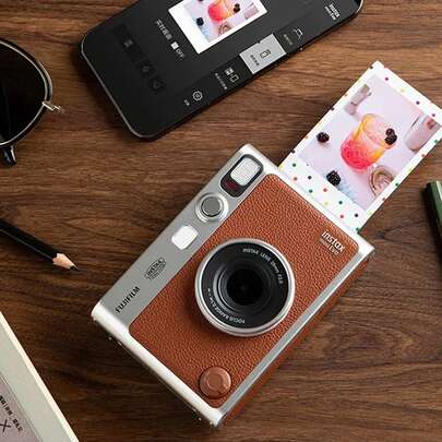 FujiFilm The Mini  Retro Instant Camera Features Bluetooth Connectivity For Direct Phone Connection, One-Click Instant Printing, And Built-In Film Filters. A Must-Have For Portable Travel.