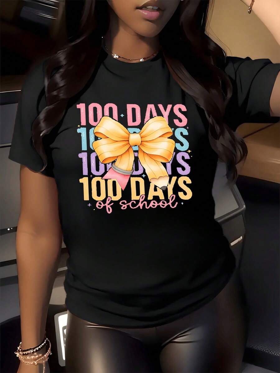 Lazo amarillo grande simbolizando alegría y logro tras cien días de aprendizaje celebrando esfuerzo escolar con colores vivos y letras brillantes camiseta de mujer casual cómoda y moderna - Negro - Ver 1