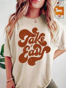Camiseta Casual con Estampado Gráfico "Take It Easy" para Mujer - Camiseta de Manga Corta con Cuello Redondo, Suave y Elástica, Lavable a Máquina, Ropa Deportiva para Comodidad en Todas las Estaciones, Camisetas para Damas - Albaricoque - Ver 1