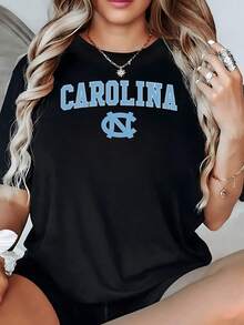 Large Blue Lettering With A Central Symbol Evokes Strength And A Collegiate Spirit, Reflecting Confidence And Positive Energy. This Comfortable, Modern Women's Casual T-Shirt Is Perfect For Everyday Wear. - Black - View 8