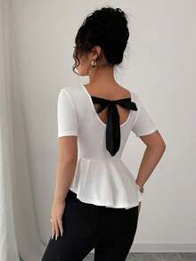 Elegante blusa de punto jacquard con lunares, lazo en la espalda, cintura ceñida y bajo asimétrico - Blanco - Ver 7