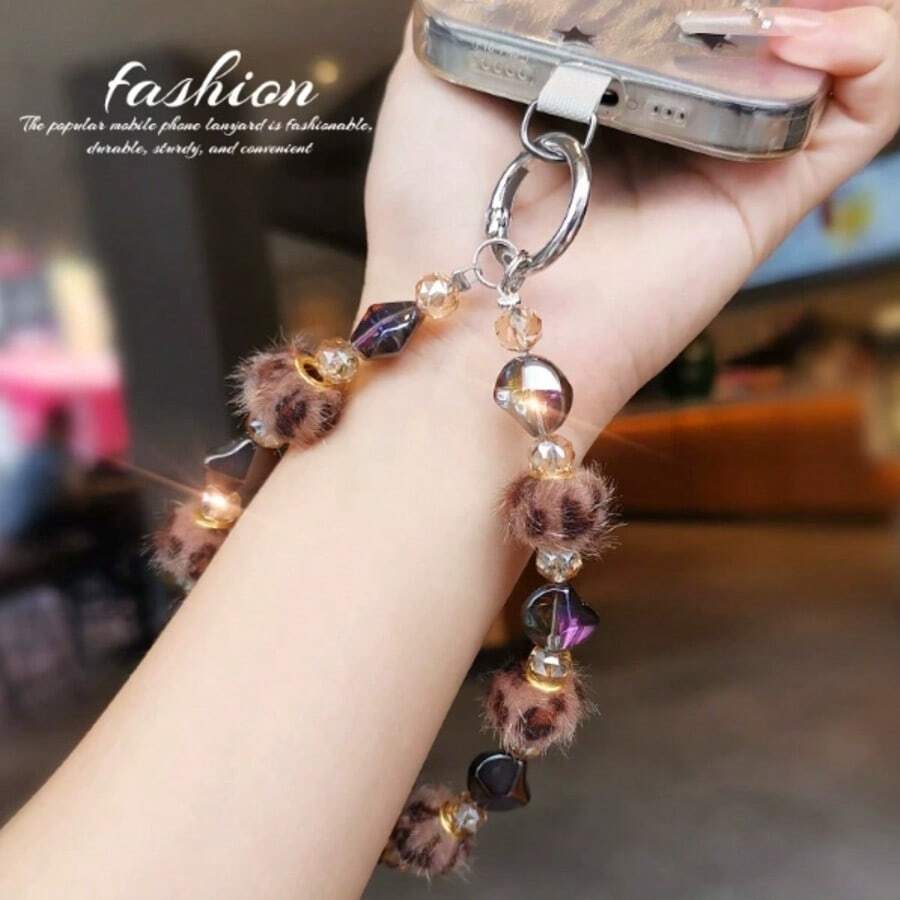 1 chiếc dây đeo điện thoại đính hạt họa tiết da báo bằng vải nhung, thích hợp để gắn vào túi xách, hộp đựng tai nghe và móc chìa khóa xe hơi.