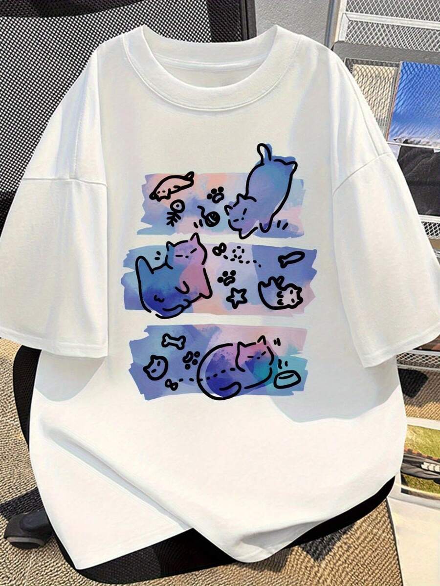 Camiseta Blanca Oversize con Gráfico de Gato Estilo Caricatura Colorido - Diseño Único con Fondo de Acuarela en Tonos Azul Pastel y Rosa, Perfecta para el Verano, Ropa Casual Cómoda y Suave, Ideal para Regalos de Cumpleaños o para Amantes de los Gatos - Blanco - Ver 1