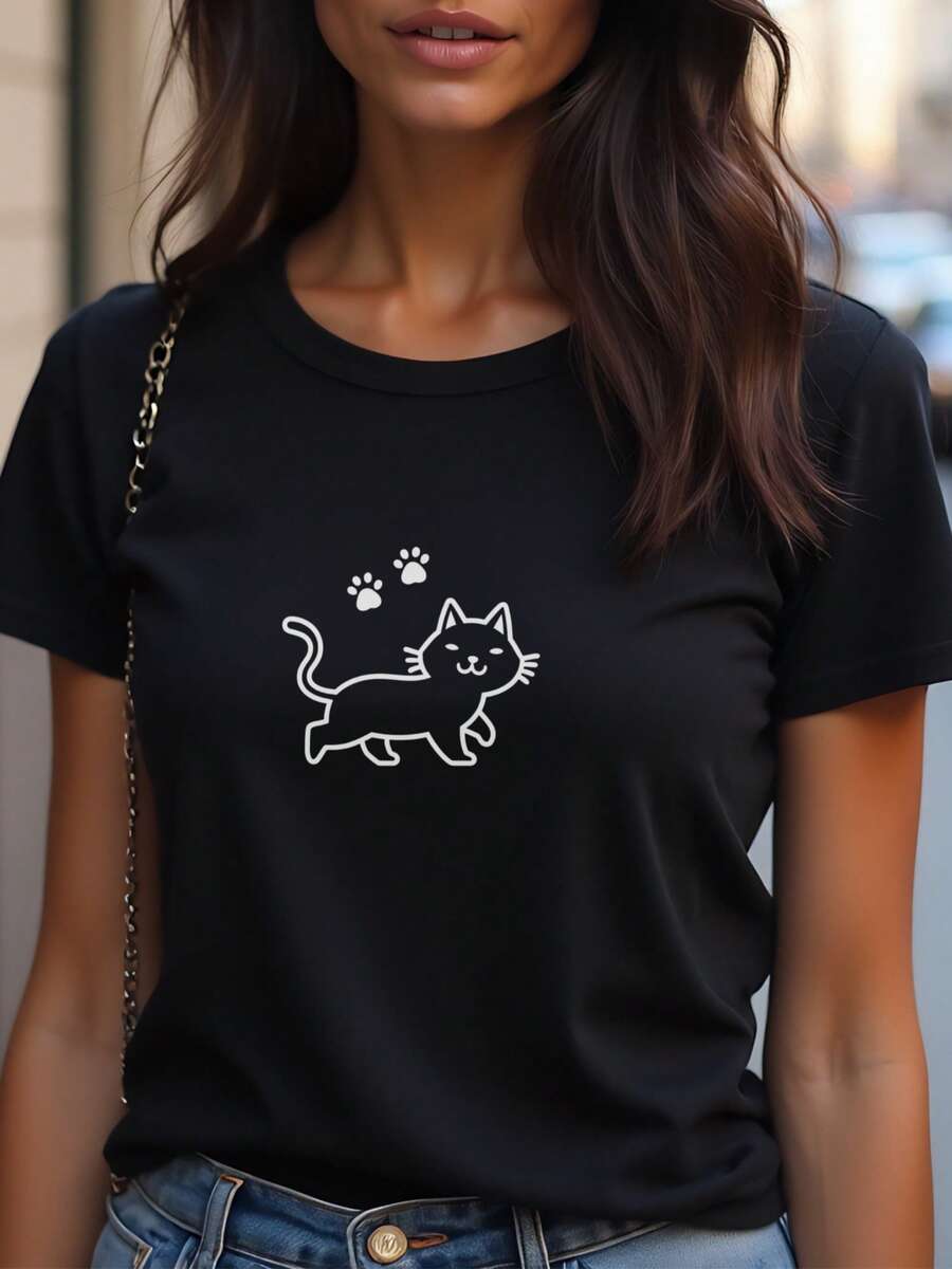 Camiseta negra vintage suave para mujer con estampado de un lindo gato blanco caminando - Camiseta casual de manga corta con cuello redondo para todas las estaciones, camiseta minimalista para el uso diario para amantes de los gatos, ropa cómoda y versátil con temática de animales, camiseta de gato para mujer, artículo de almacén local para mujer, blusa hermosa para mujer, camiseta para mujer, camiseta gráfica para mujer, camiseta para mujer, camisa de mujer, blusa de mujer, top para mujer, ropa de gimnasio para mujer, tops para mujer. - Negro - Ver 1