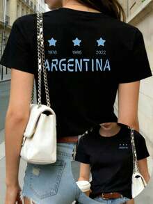 Camiseta Casual PremiumMommy And Me para Mujer - Camiseta con Estampado Conmemorativo de la Triple Corona de la Copa Mundial de Argentina para Mujer, con Patrón, Cuello Redondo Casual, Manga Corta, Top de Moda de Verano para Mujer, Doble Estampado en la Parte Delantera y Trasera, Camiseta para Uso Diario, Regalo para el Día de la Madre, Ecológica. - Negro - Ver 8
