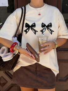 Limited Edition Women's Short-Sleeved, Round-Neck T-Shirt With Bow Print, Casual And Loose Fit, Versatile, For Everyday Wear In White. Lightweight Cotton. - 白色的 - 查看 1