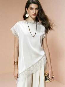 Blusa de mujer , de tela de piqué con lunares en blanco y negro, con empalme de encaje de unicolor y bajo asimétrico, elegante para citas y atuendos de verano - Blanco - Ver 7