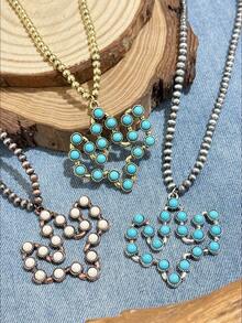 Bộ dây chuyền đá Turquoise hình cây xương rồng rỗng theo phong cách Bohemian cổ điển châu Âu và Mỹ. Được thiết kế dựa trên họa tiết cây xương rồng rỗng, với nhiều hạt đá Turquoise tròn được xâu chuỗi với nhau, kết hợp với khung kim loại mài mòn và dây chuyền hạt. Có các lựa chọn màu sắc: đồng cổ - trắng Turquoise, vàng cổ - xanh Turquoise và bạc cổ - xanh Turquoise, thể hiện hoàn hảo phong cách miền Tây. Thiết kế tổng thể nhẹ nhàng và năng động, toát lên vẻ sang trọng cổ điển. - Cây xương rồng nhiều màu - Xem 6