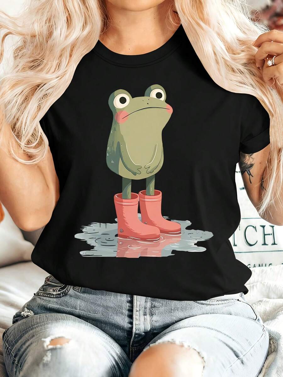 [Summer Energy] Ropa de Verano para Mujer: Una camiseta de manga corta con cuello redondo que muestra una rana pequeña de pie en un charco con botas de lluvia rosas. Cómoda, suave, elegante, adecuada para fiestas, estilo vintage, casual, versátil. Adecuada para primavera, verano, otoño e invierno, top de estilo deportivo, 100% algodón. - Negro - Ver 1