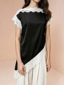 Blusa de mujer , de tela de piqué con lunares en blanco y negro, con empalme de encaje de unicolor y bajo asimétrico, elegante para citas y atuendos de verano - Blanco y Negro - Ver 5