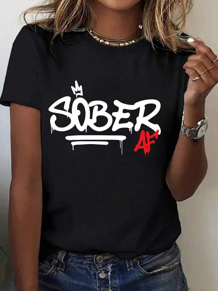 Recomiendo encarecidamente la camiseta casual para mujer con estampado de grafiti 'Sober' - Cuello redondo, manga corta, blanca, cómoda para todas las estaciones, perfecta para actividades al aire libre y como regalo para las fiestas, camiseta de regalo de estilo casual vanguardista, tela suave, fácil de combinar. - Negro - Ver 1