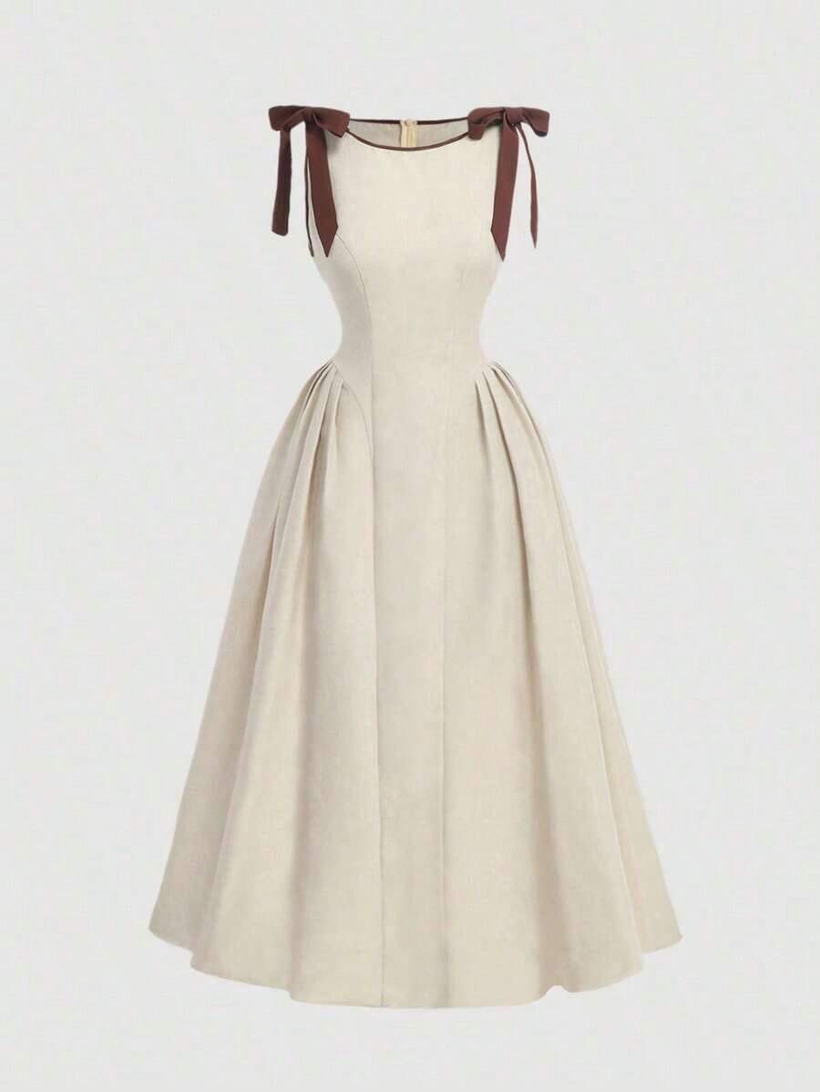 Vestido color albaricoque con cuello redondo, sin mangas, con ribete de contraste, lazo decorativo en la cintura y bajo acampanado - Caqui - Ver 1