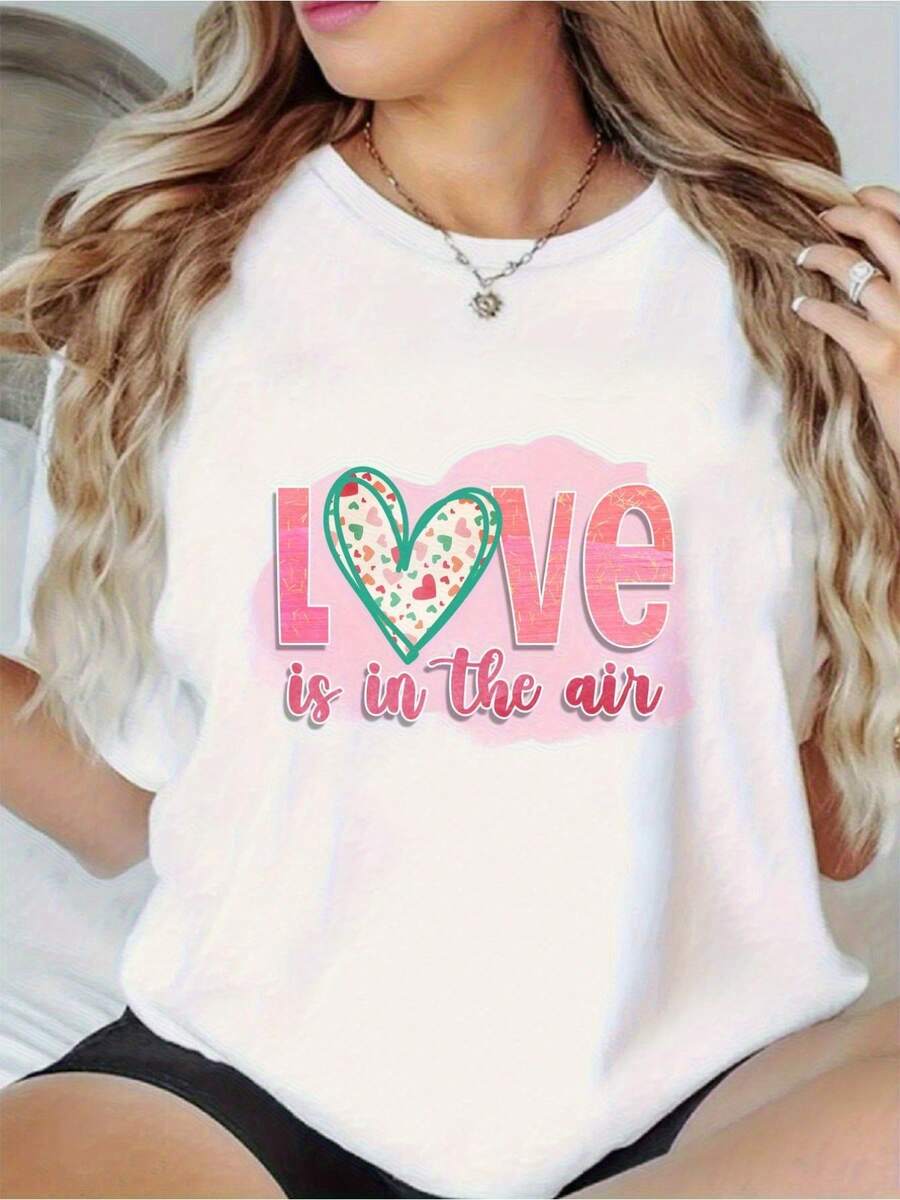 Premium White T-Shirt Adorned With A Heart-Shaped Balloon Pattern And The Phrase "Love Is In The Air," Soft Pink Lettering, And A Green Cupcake Design. Comfortable, Loose-Fitting, Crew Neck, Ideal For Casual Summer Parties, Suitable For All Seasons, Machine Washable, An Everyday Wardrobe Essential. Fun Design, Lightweight, Stylish T-Shirt-A Favorite Among Fashion Lovers. New Arrival - 白色 - 查看 1