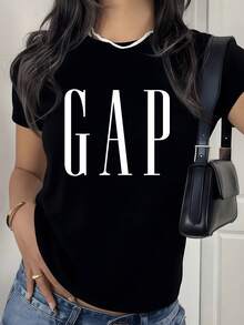 Large Lettering In The Center Symbolizes Confidence, Openness, And Balance Between Simplicity And Inner Strength. A Modern, Comfortable, Casual Women's T-Shirt For Everyday Wear. - 黑色 - 查看 1